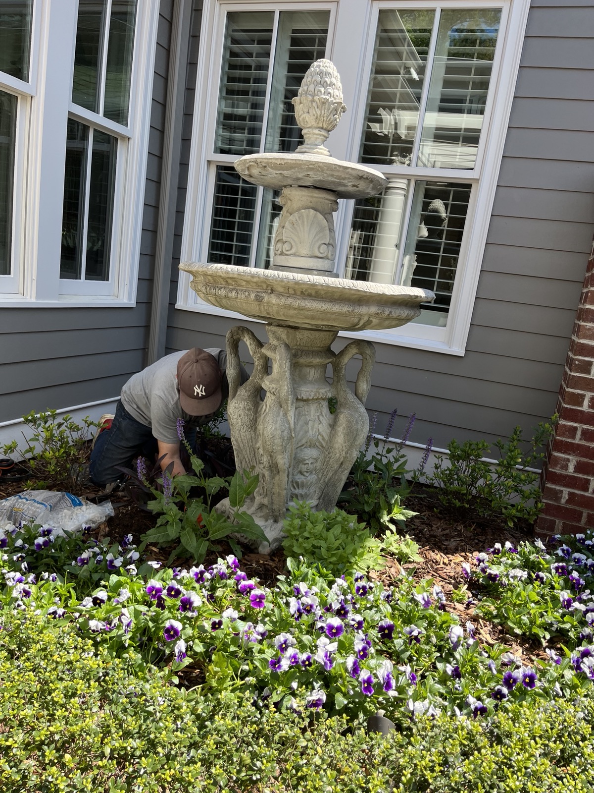 Leaning fountain before releveling, Raleigh NC