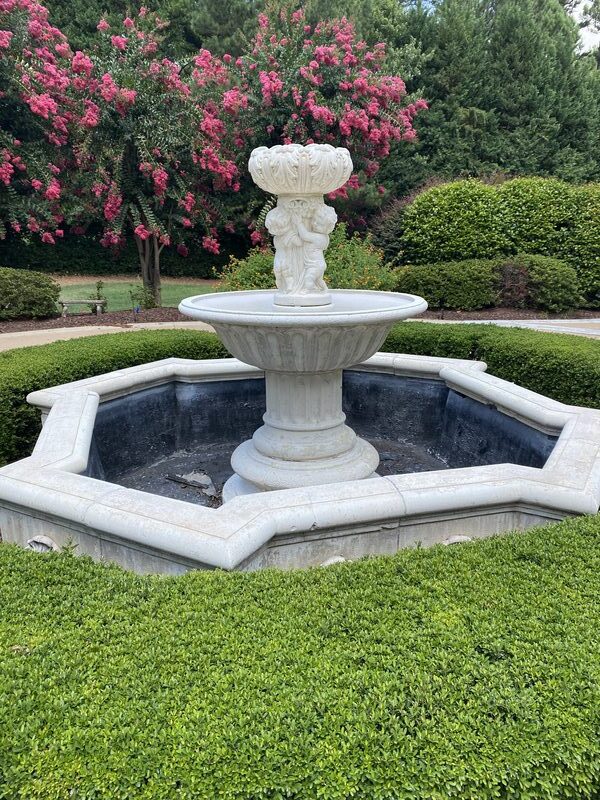 Classic tiered fountain in garden setting, Raleigh